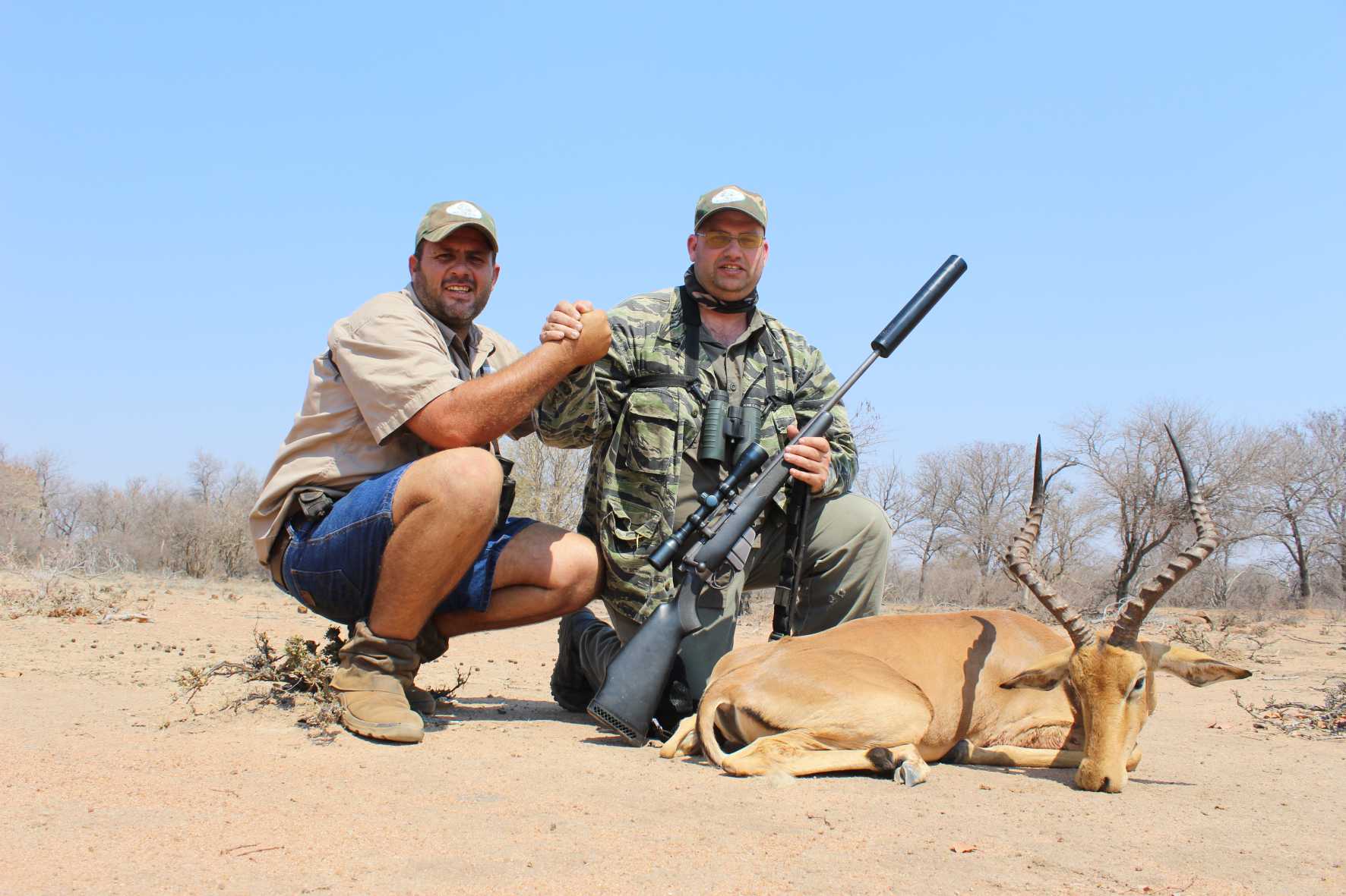 A client next to their hunting trophy