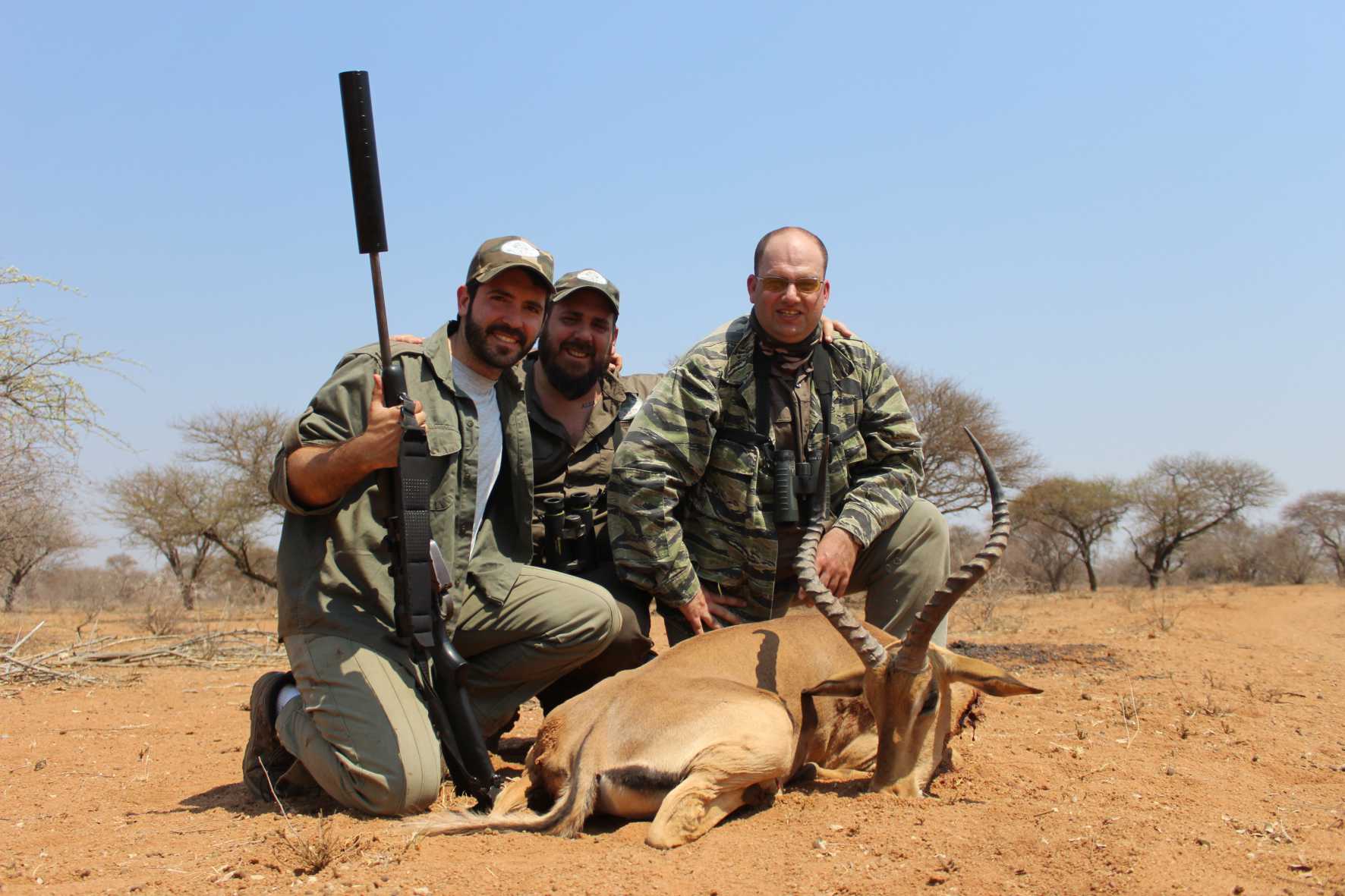 A client next to their hunting trophy