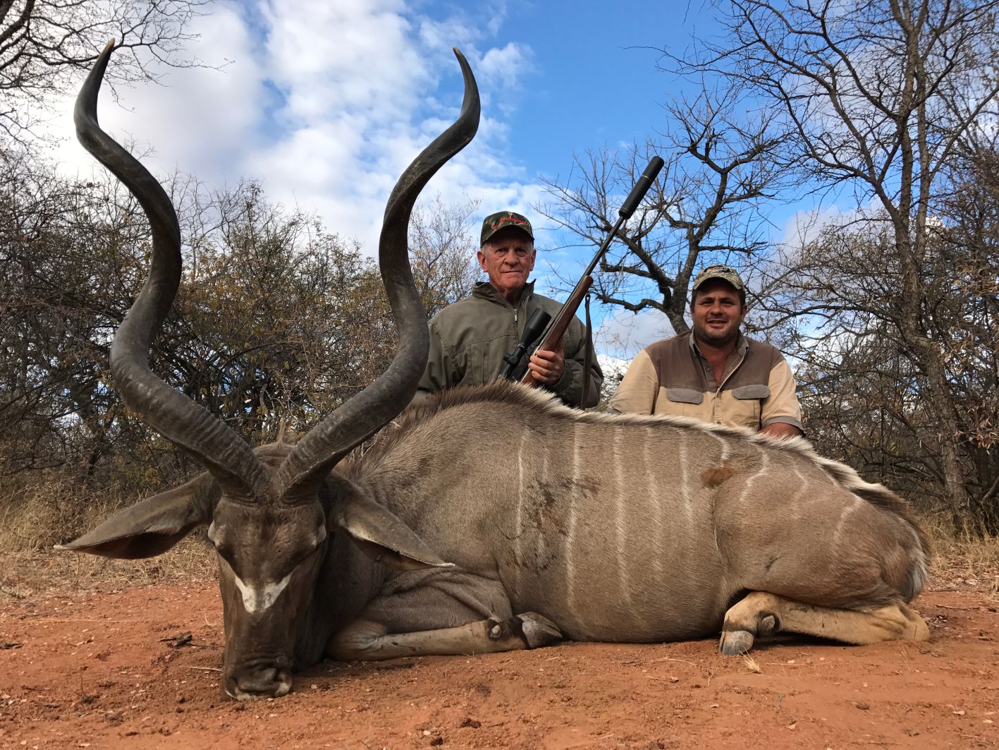 A client next to their hunting trophy