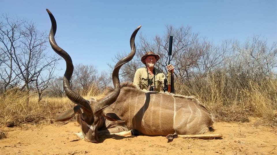 A client next to their hunting trophy