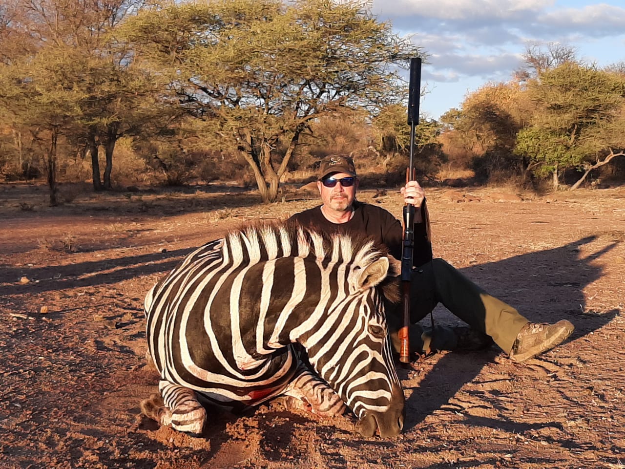 A client next to their hunting trophy
