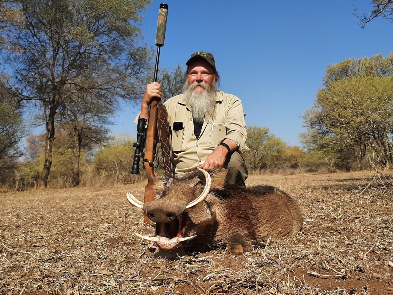 A client next to their hunting trophy