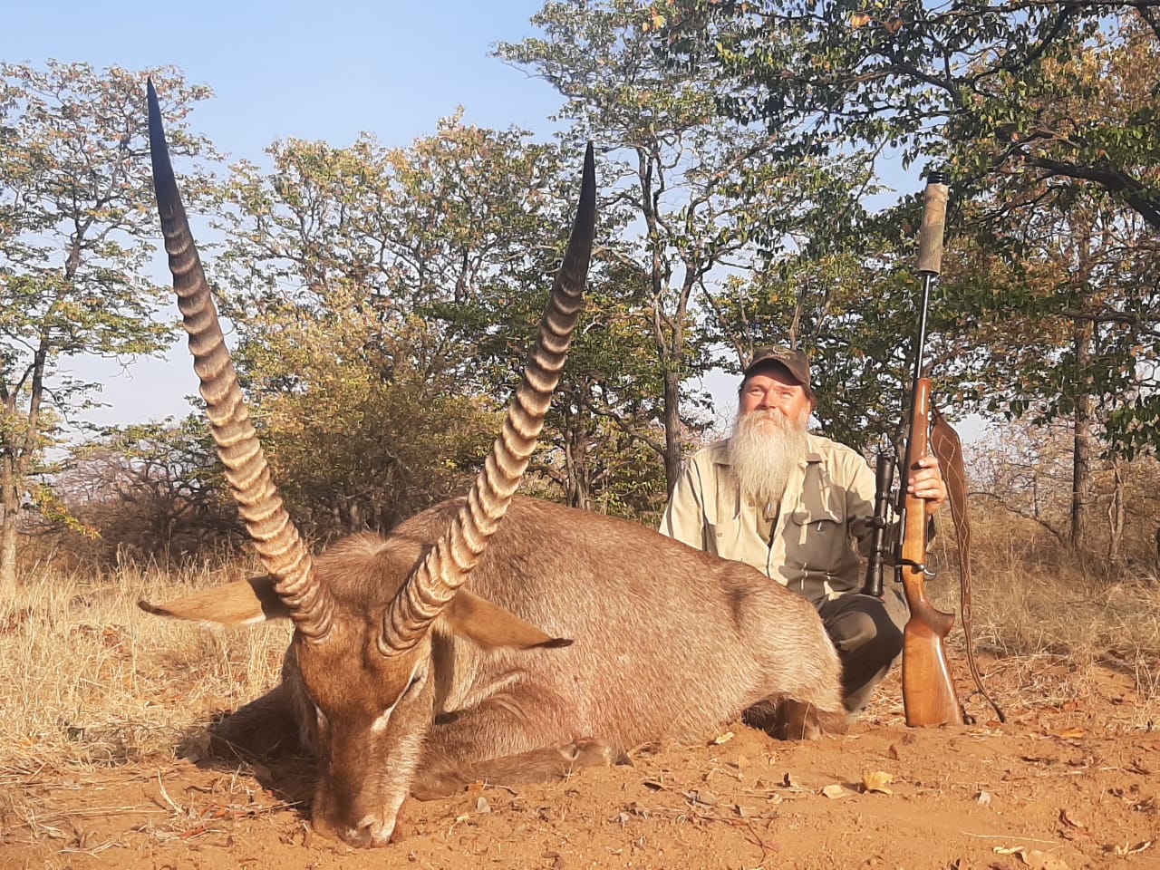 A client next to their hunting trophy