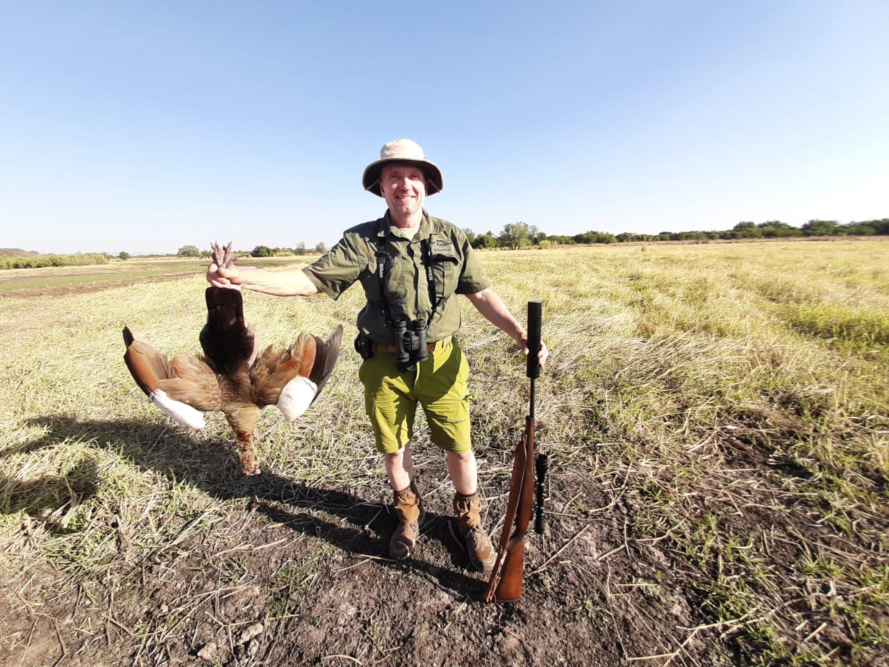 A client next to their hunting trophy
