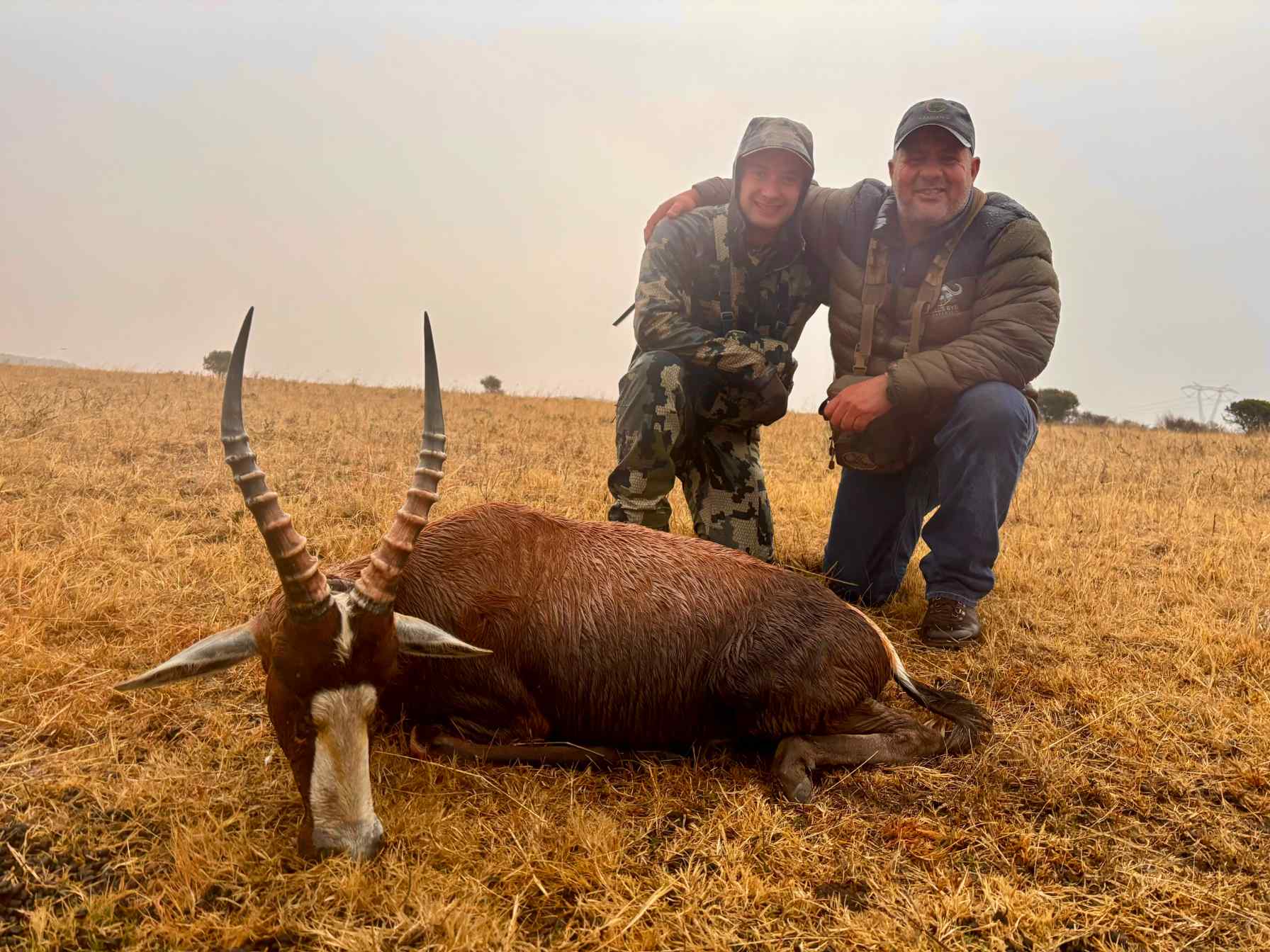 A client next to their hunting trophy